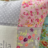 Ditsy bunnies and floral name and date cushion