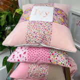 Peachy pink patchwork name cushion