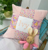 Peachy pink patchwork name cushion